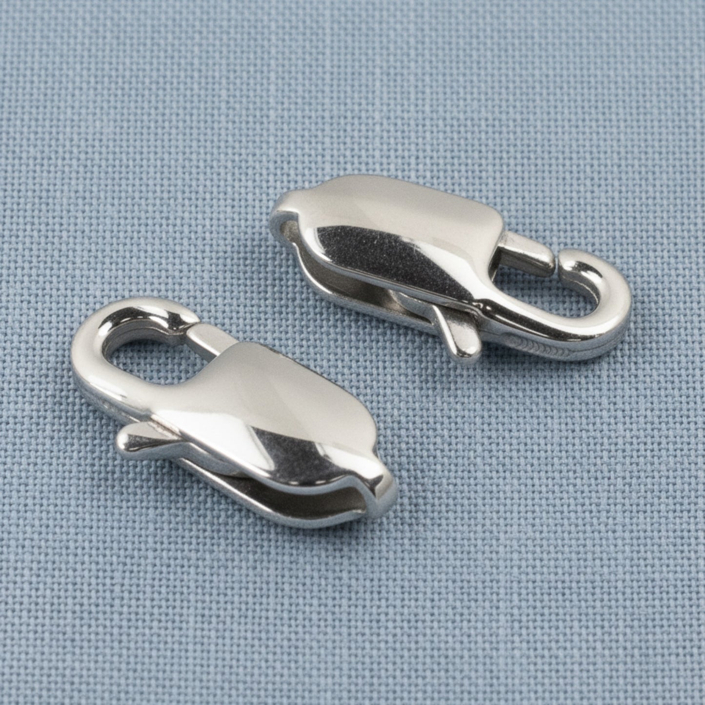 Hackberry Creek large oval stainless steel lobster claw clasps with a polished silver finish for jewelry making