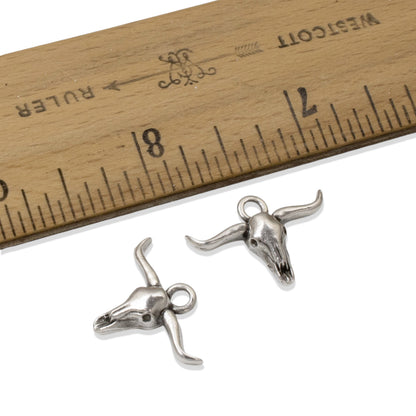Hackberry Creek silver longhorn steer skull charms with antique finish for southwestern DIY jewelry making.