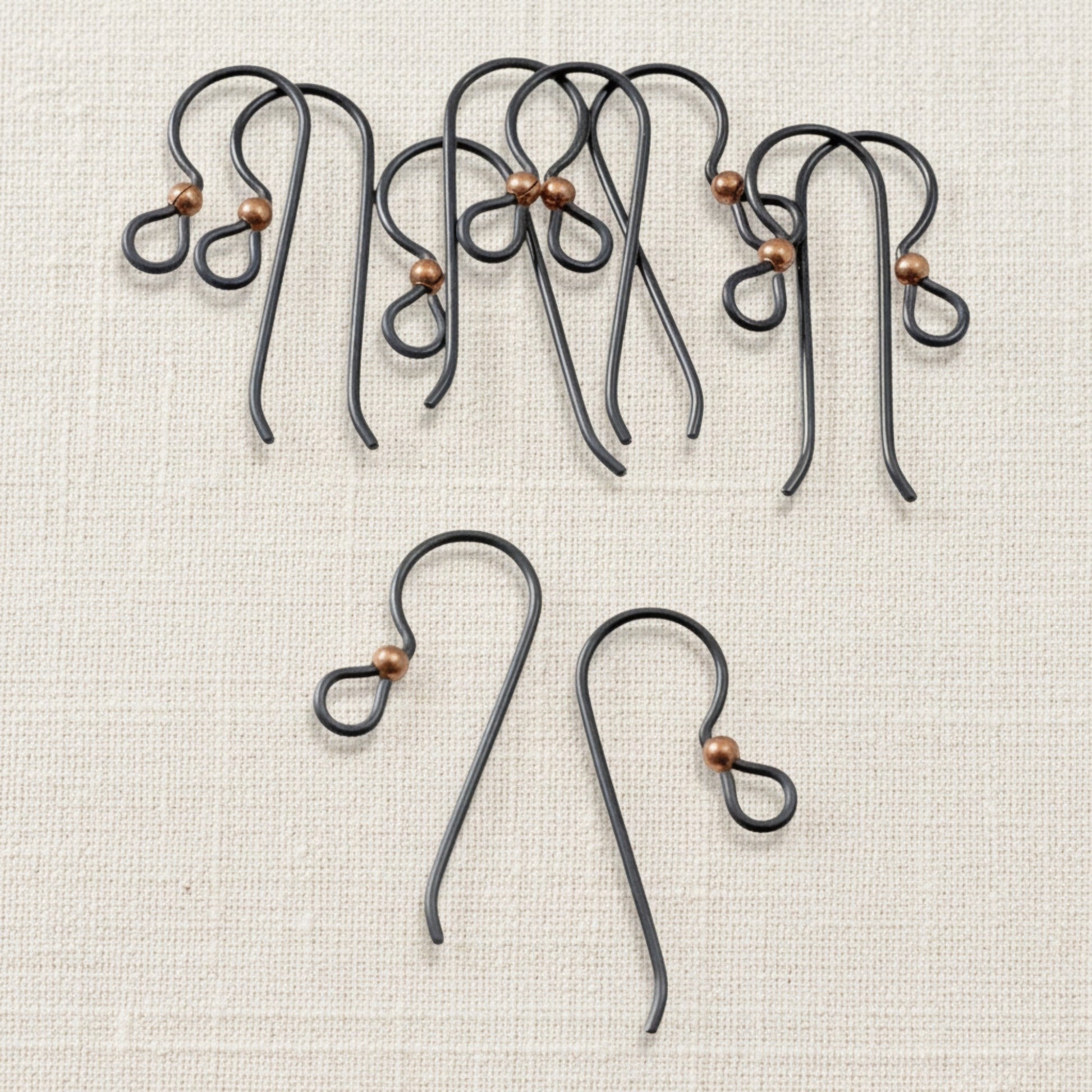 Hackberry Creek matte black niobium earring hooks with copper bead, 10-pack, hypoallergenic for sensitive ears.