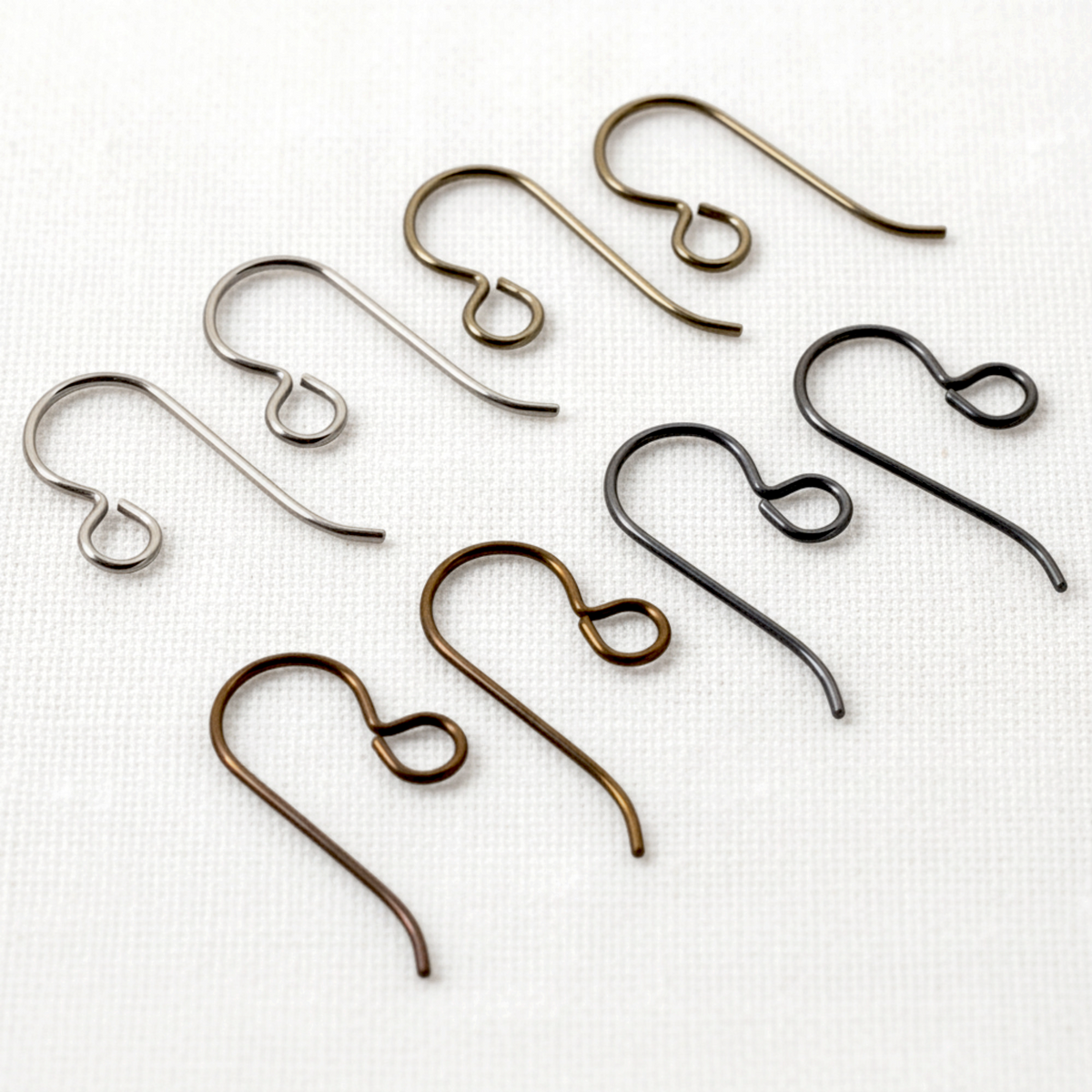 Hackberry Creek niobium ear wire variety pack featuring gray, bronze, black, and antique brass hypoallergenic hooks.
