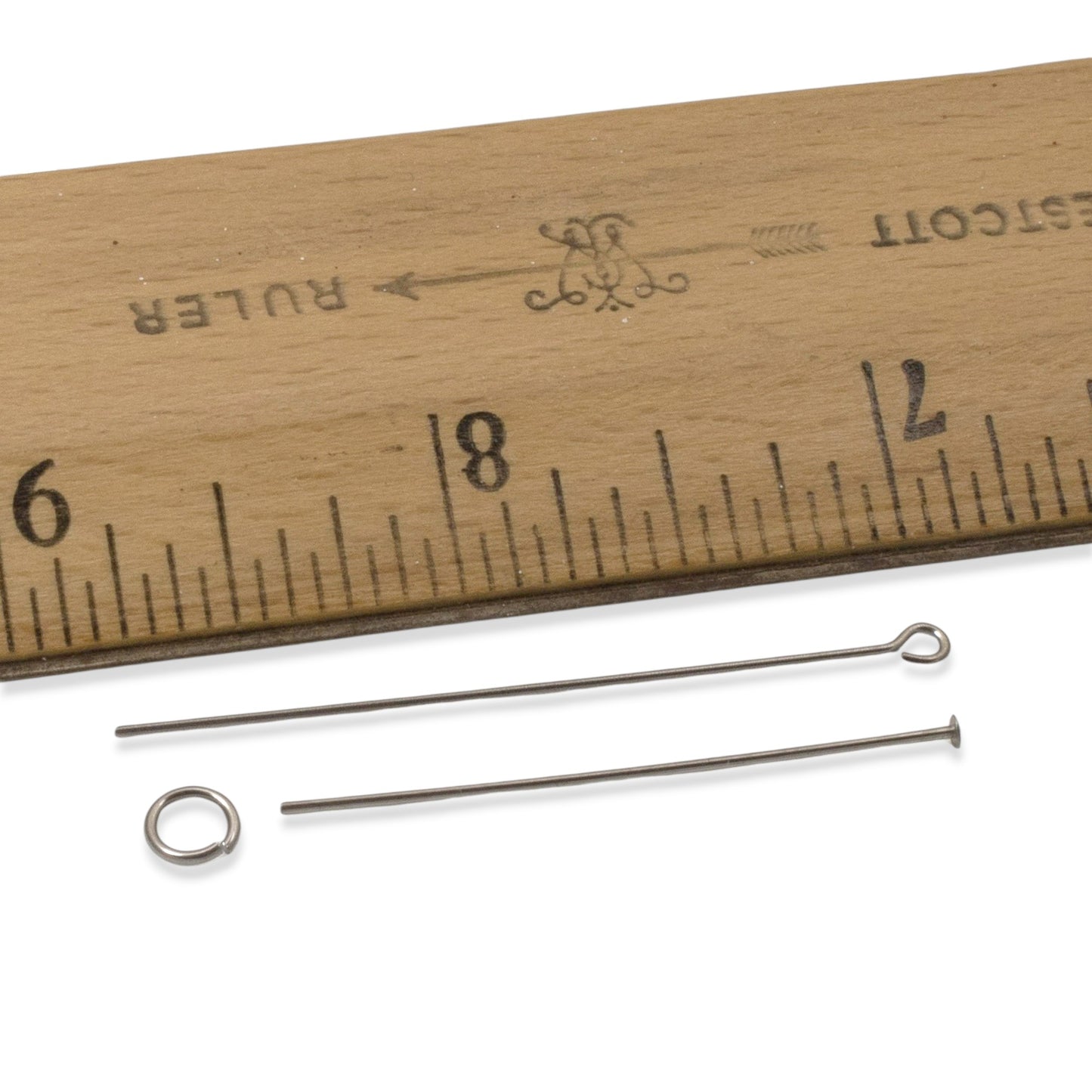 Hackberry Creek gray niobium earring kit findings: 2 ear wires, 1 head pin, 1 eye pin, and 1 jump ring shown with a ruler.