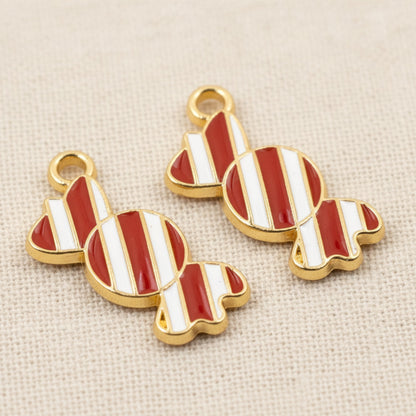 Hackberry Creek peppermint candy charms with red and white striped enamel and gold-plated metal for holiday crafts.