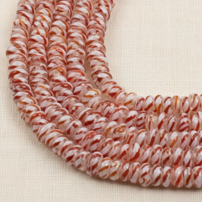 Hackberry Creek red and white peppermint stripe glass lampwork rondelle beads on a 17-inch strand for jewelry making