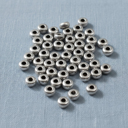 Hackberry Creek 3mm pewter disk beads, smooth heishi spacer beads for jewelry making.