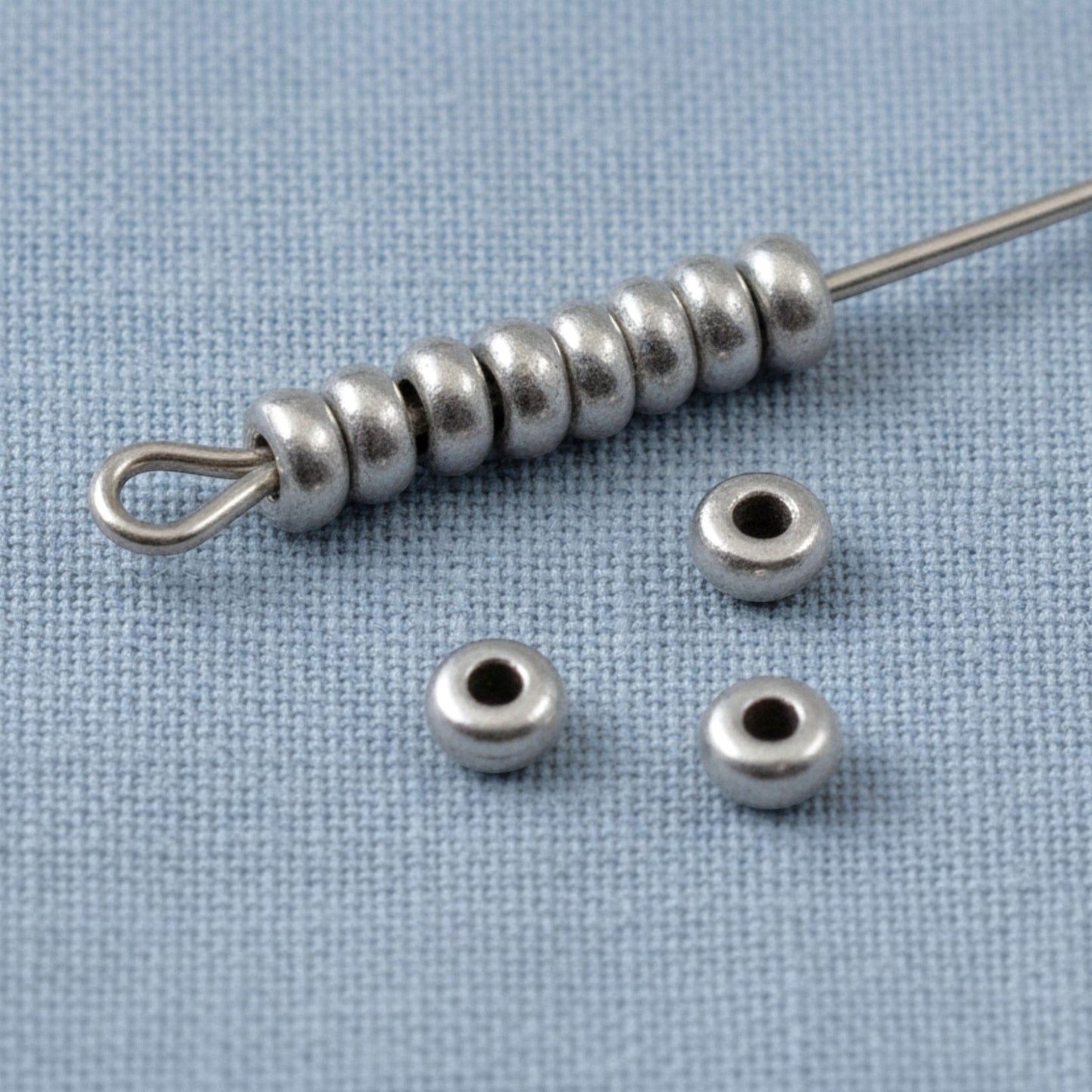 Hackberry Creek pewter 3mm smooth heishi disk spacer beads on a needle, 50-pack