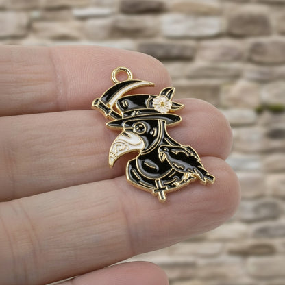 Hackberry Creek plague doctor raven head charm with black and white enamel and gold plating for gothic jewelry
