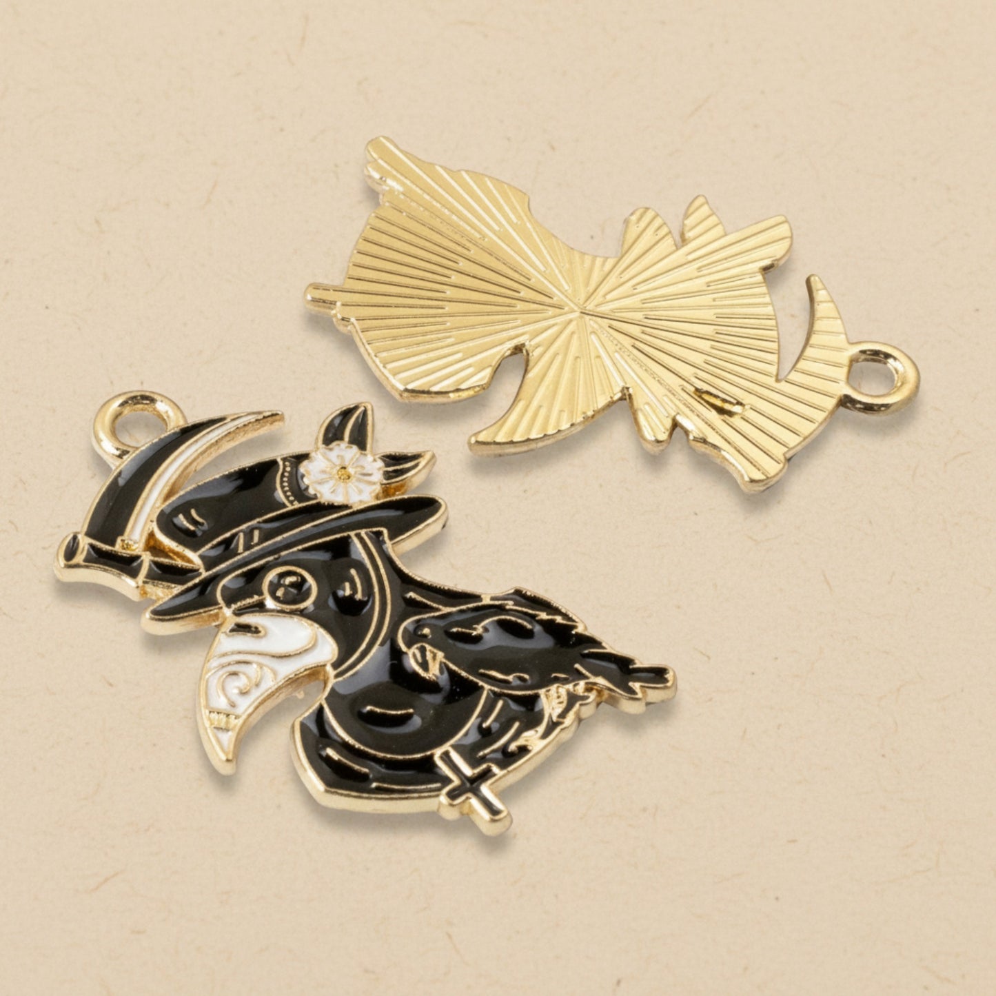 Hackberry Creek plague doctor raven head charms in black and white enamel with gold plating for gothic jewelry