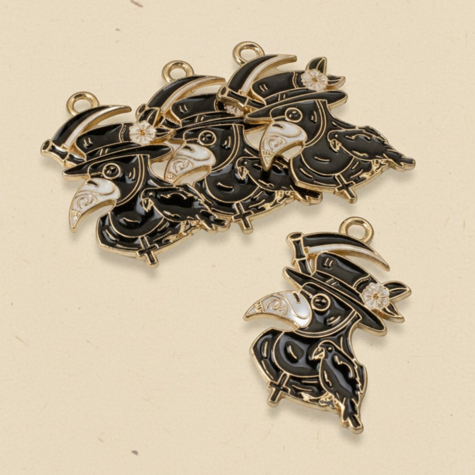 Hackberry Creek plague doctor raven head charms in black and white enamel with gold plating for gothic jewelry making.