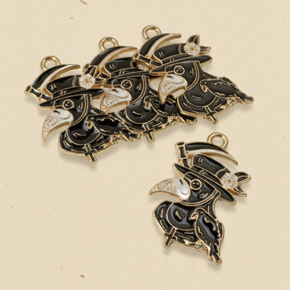 Hackberry Creek plague doctor raven head charms in black and white enamel with gold plating for gothic jewelry making.