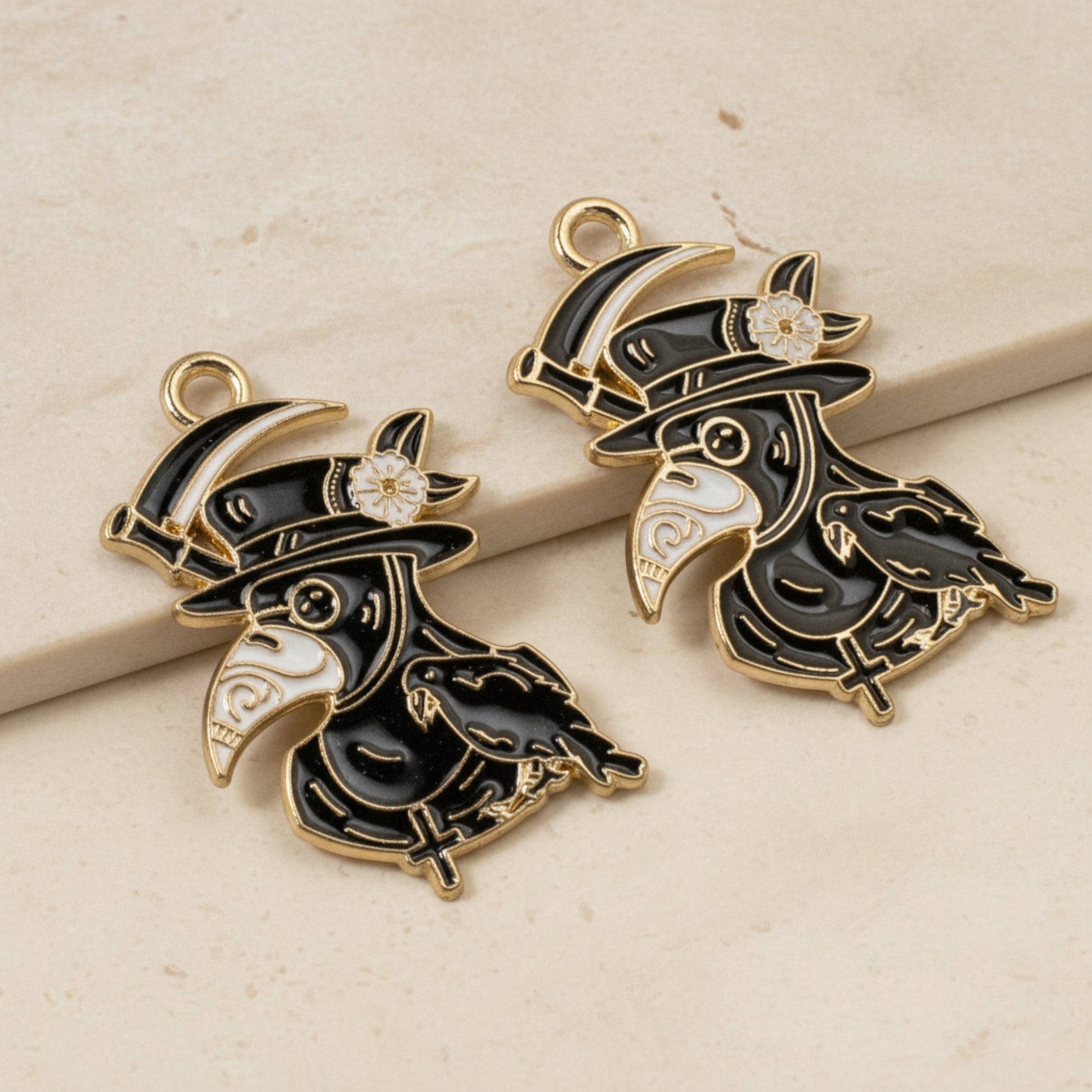 Hackberry Creek plague doctor raven head charms in black and white enamel with gold plating for gothic jewelry