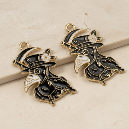 Hackberry Creek plague doctor raven head charms in black and white enamel with gold plating for gothic jewelry
