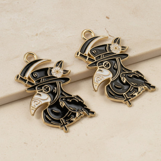 Hackberry Creek plague doctor raven head charms in black and white enamel with gold plating for gothic jewelry