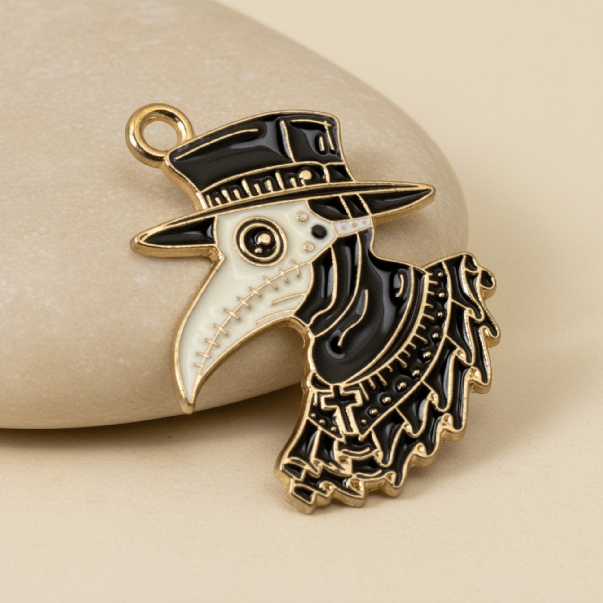 Hackberry Creek plague doctor raven head pendant in black and white enamel with gold plating for gothic jewelry making.