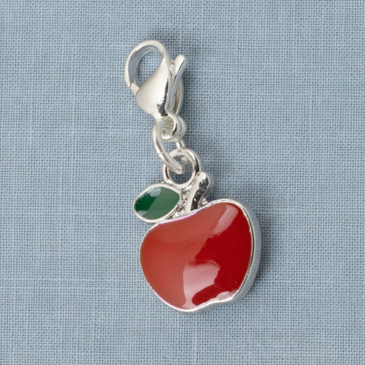 Hackberry Creek red apple charm with green leaf accent, silver-plated brass and enamel, 1 1/2" long, clip-on clasp.
