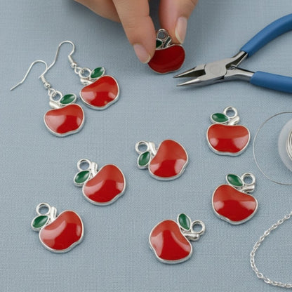 Hackberry Creek bright red enamel apple charms with green leaves, silver metal alloy, for jewelry making.