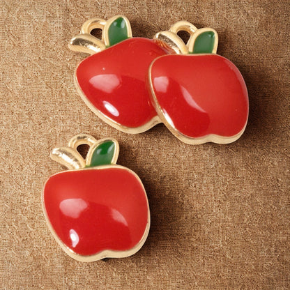 Hackberry Creek glossy red enamel apple charms with gold plating and green leaf detail for jewelry making