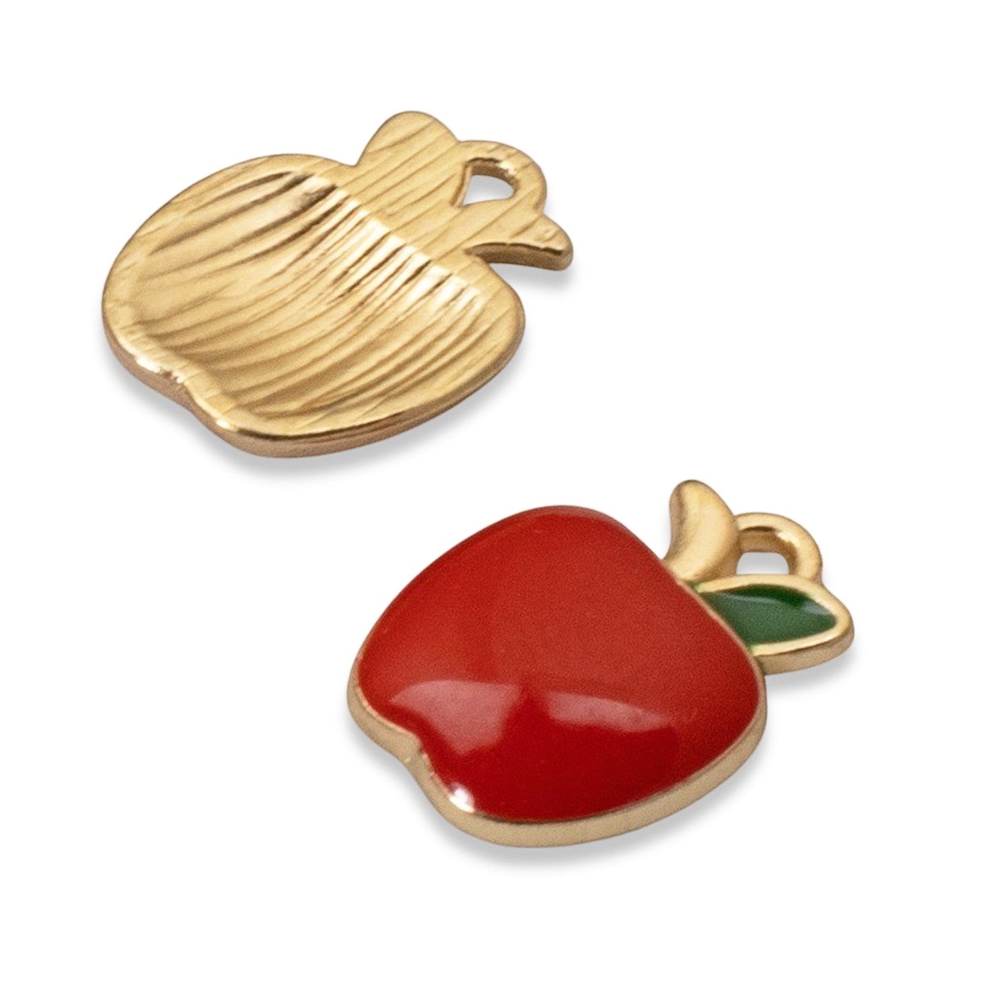 Hackberry Creek apple charms featuring glossy red enamel, green leaf detail, and gold-plated metal alloy back.