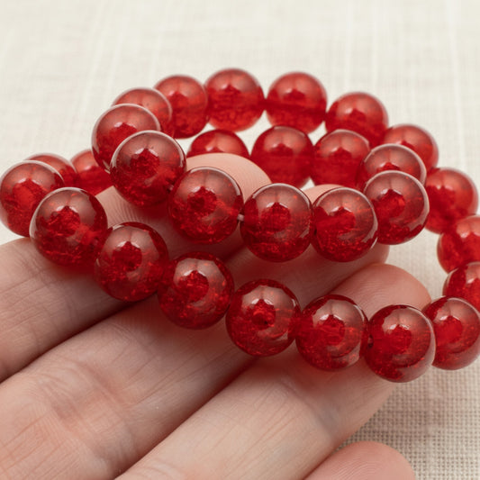 Hackberry Creek 10mm round red glass crackle beads for jewelry making. Pack of 30.