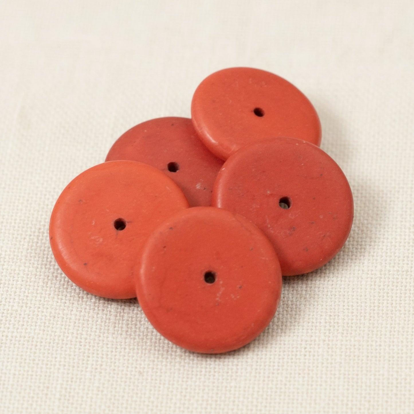 Hackberry Creek muted red magnesite stone rondelle disk beads for jewelry making, 20mm size with natural markings.