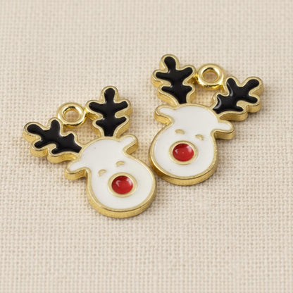 Hackberry Creek reindeer enamel charms with white faces, red noses, and black antlers on gold-plated metal bases.