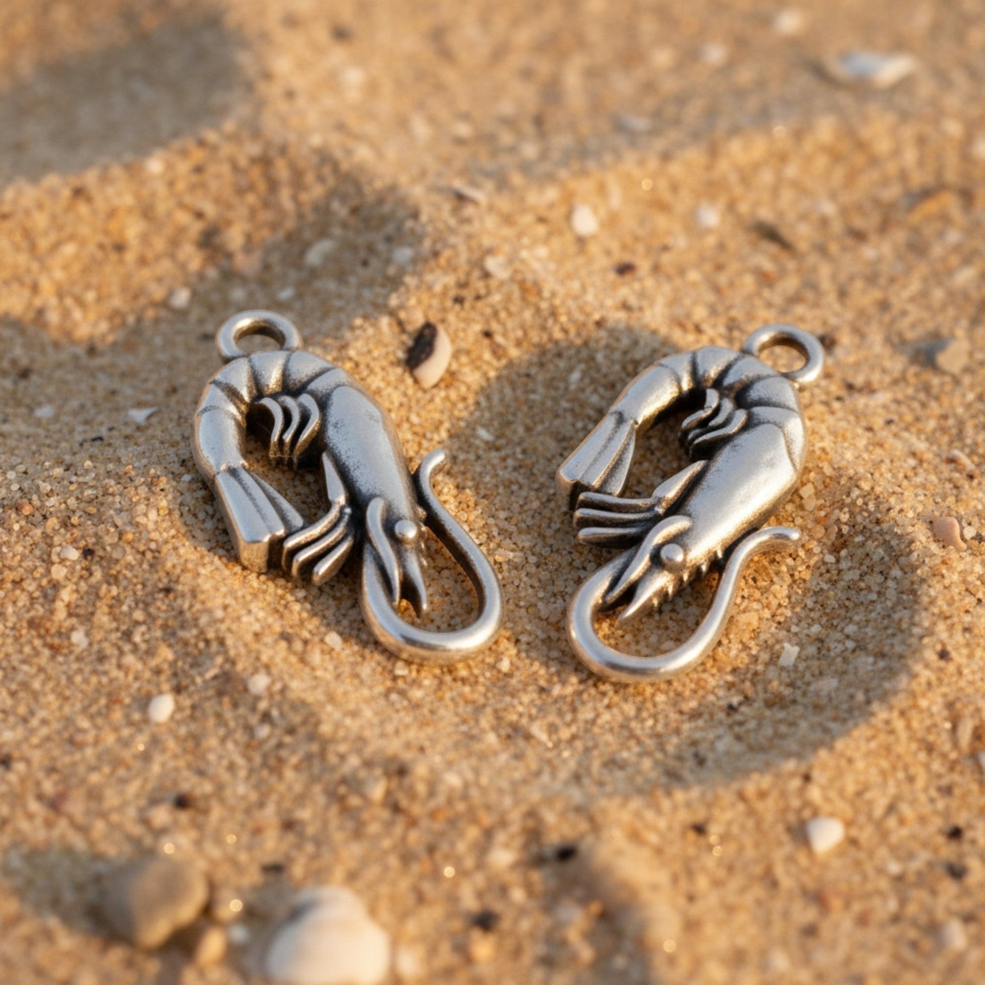 Hackberry Creek antique silver shrimp charms with detailed segmented bodies and tails, perfect for coastal jewelry.