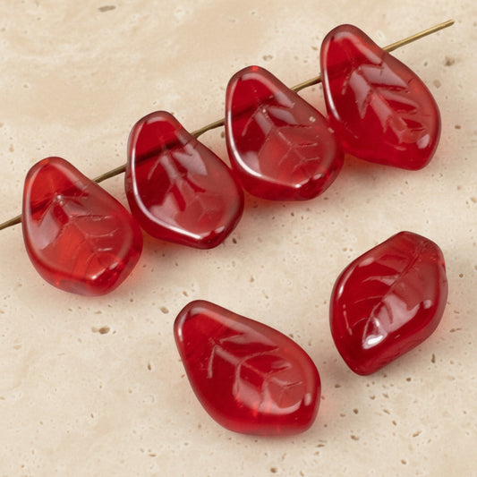 Hackberry Creek transparent Siam red Czech glass leaf beads with intricate veining for jewelry making