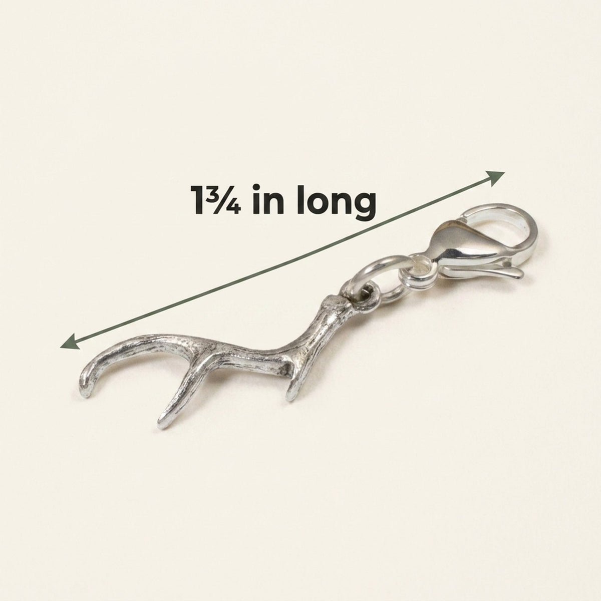 Hackberry Creek silver antler clip-on charm with a lobster clasp, measuring 1 3/4 inches for bags and jewelry.