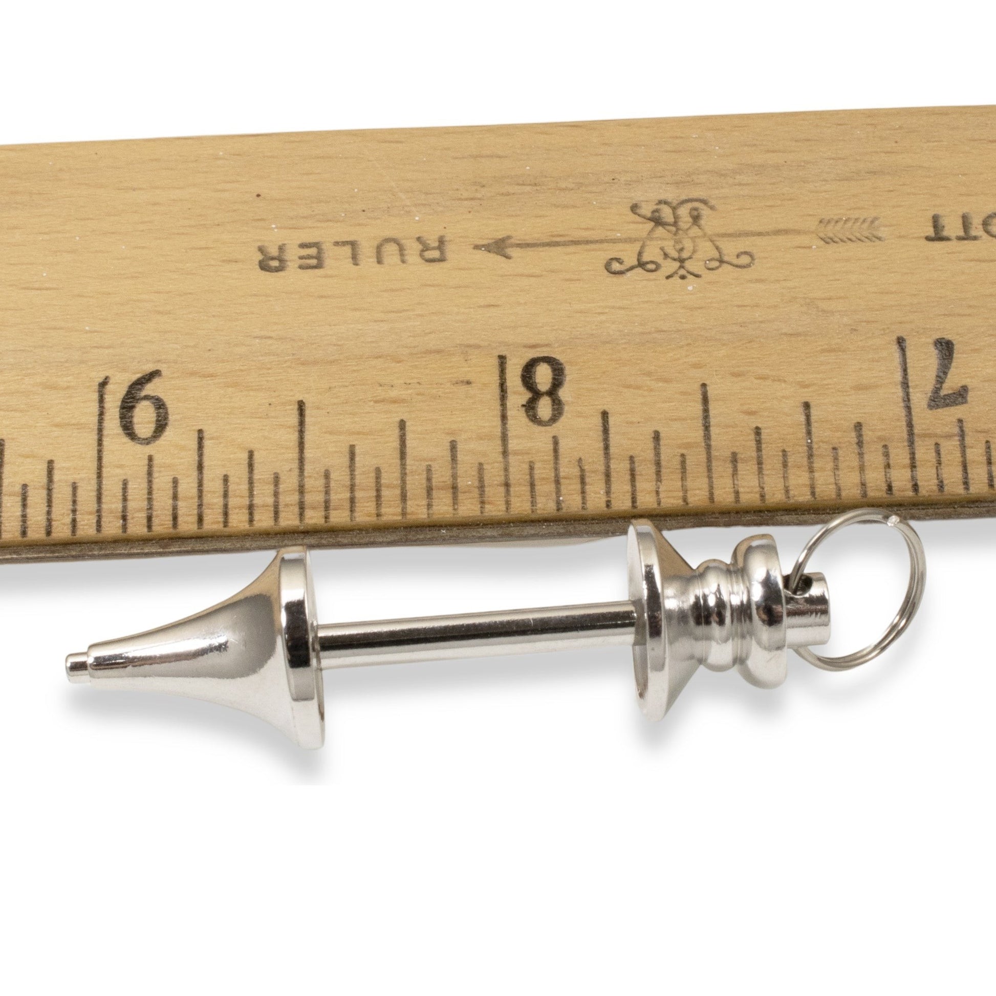 Hackberry Creek silver zinc alloy beadable pendant blank for jewelry making shown next to a wooden ruler for scale