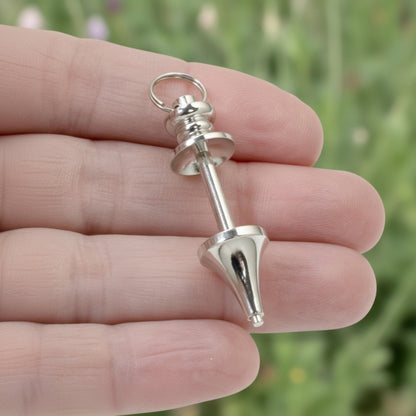 Hackberry Creek silver zinc alloy beadable pendant blank for custom jewelry and keychain designs held in hand