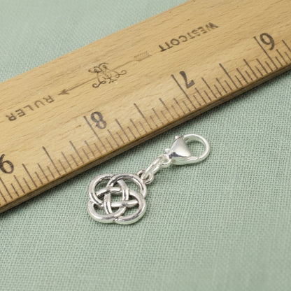 Hackberry Creek silver plated metal alloy Celtic knot charm with stainless steel lobster clasp, 1 3/8" length.