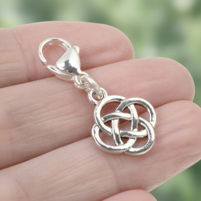 Hackberry Creek silver plated metal alloy Celtic knot charm with stainless steel lobster clasp. Open design.
