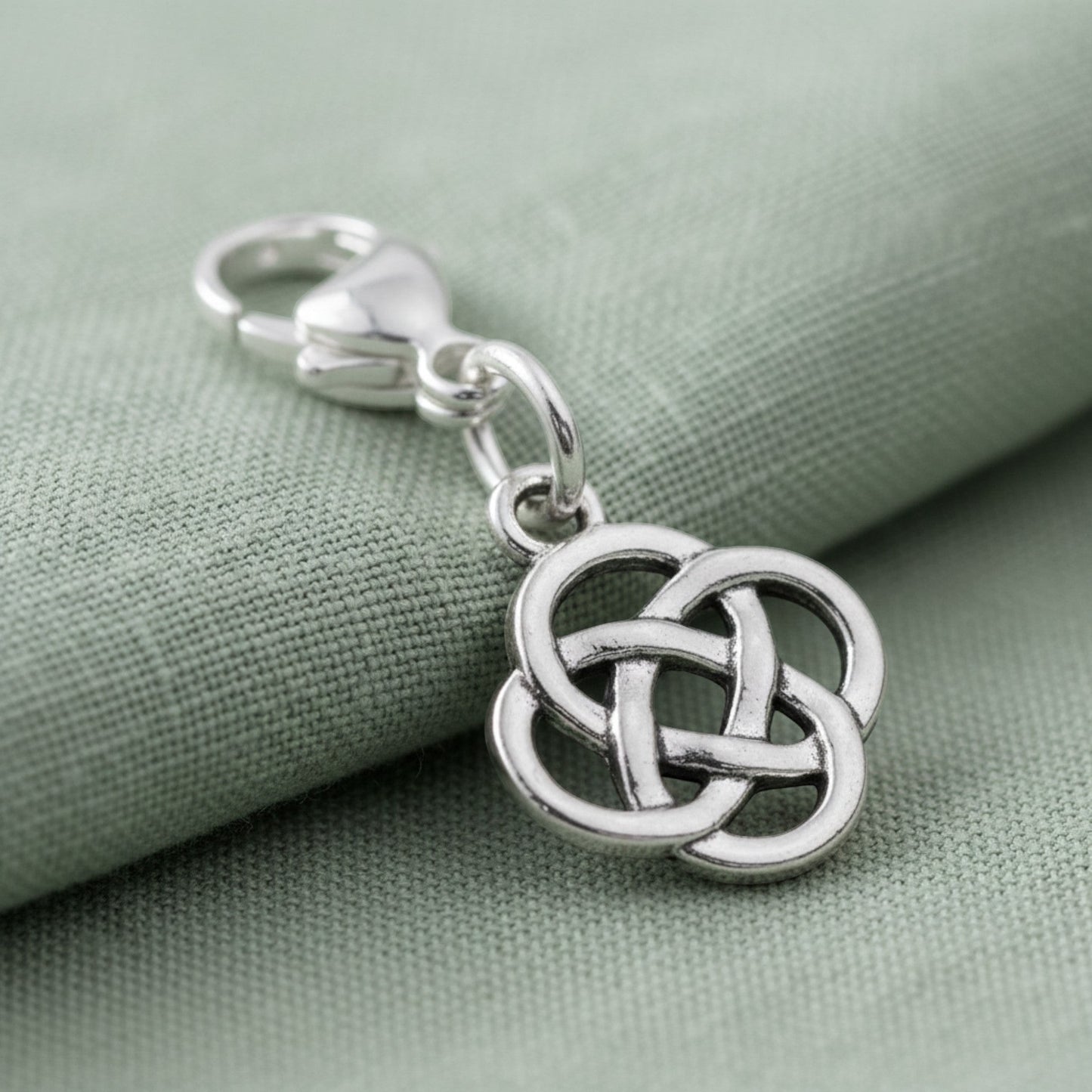 Hackberry Creek silver plated metal alloy Celtic knot charm with stainless steel lobster clasp.