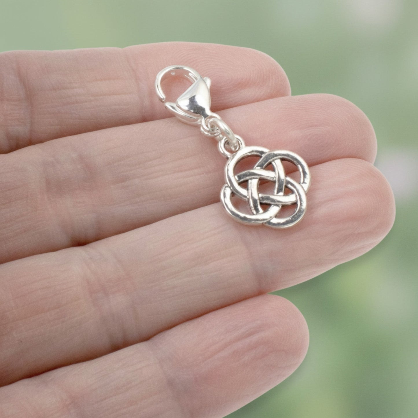 Hackberry Creek silver plated metal alloy Celtic knot charm with stainless steel lobster clasp. Open design, 1 3/8" length.