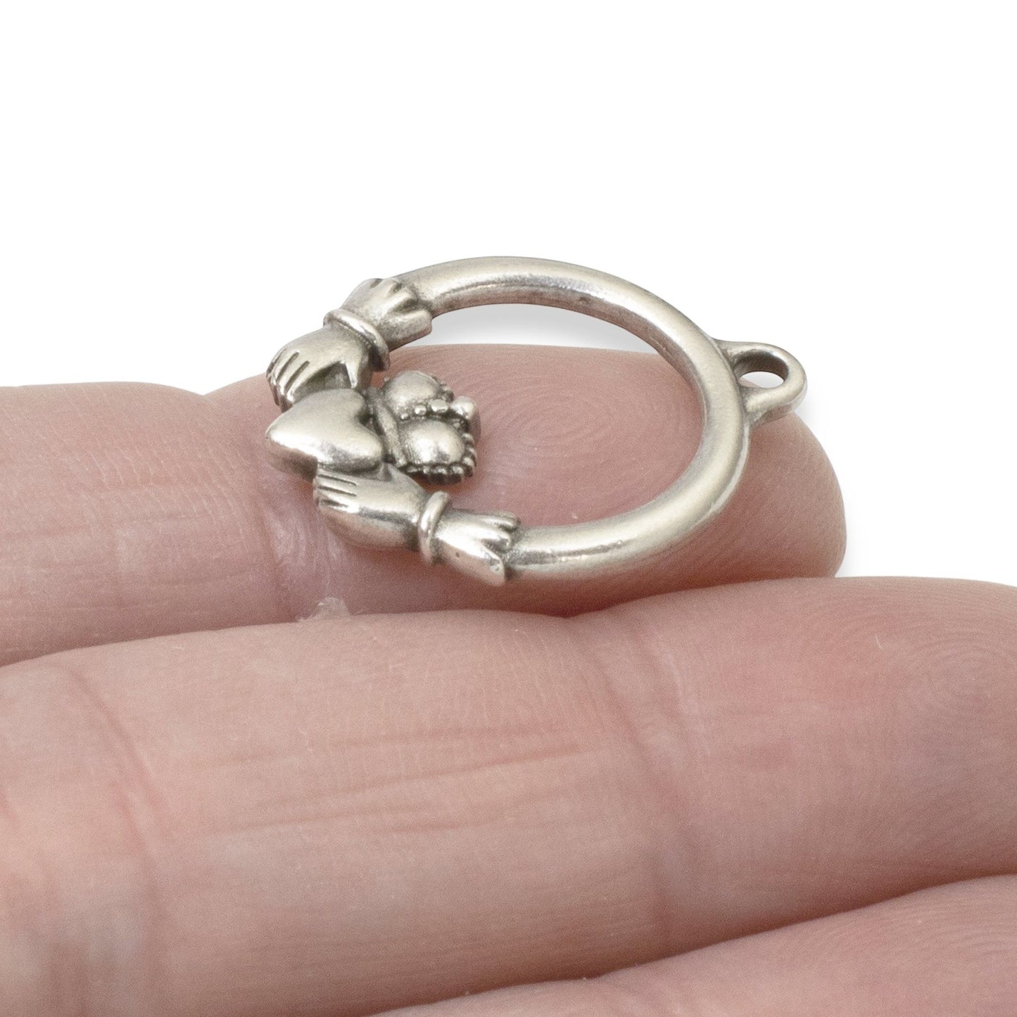 Hackberry Creek antique silver Claddagh charm pendant, symbolizing love, loyalty, and friendship. Pewter with .999 fine silver plating.