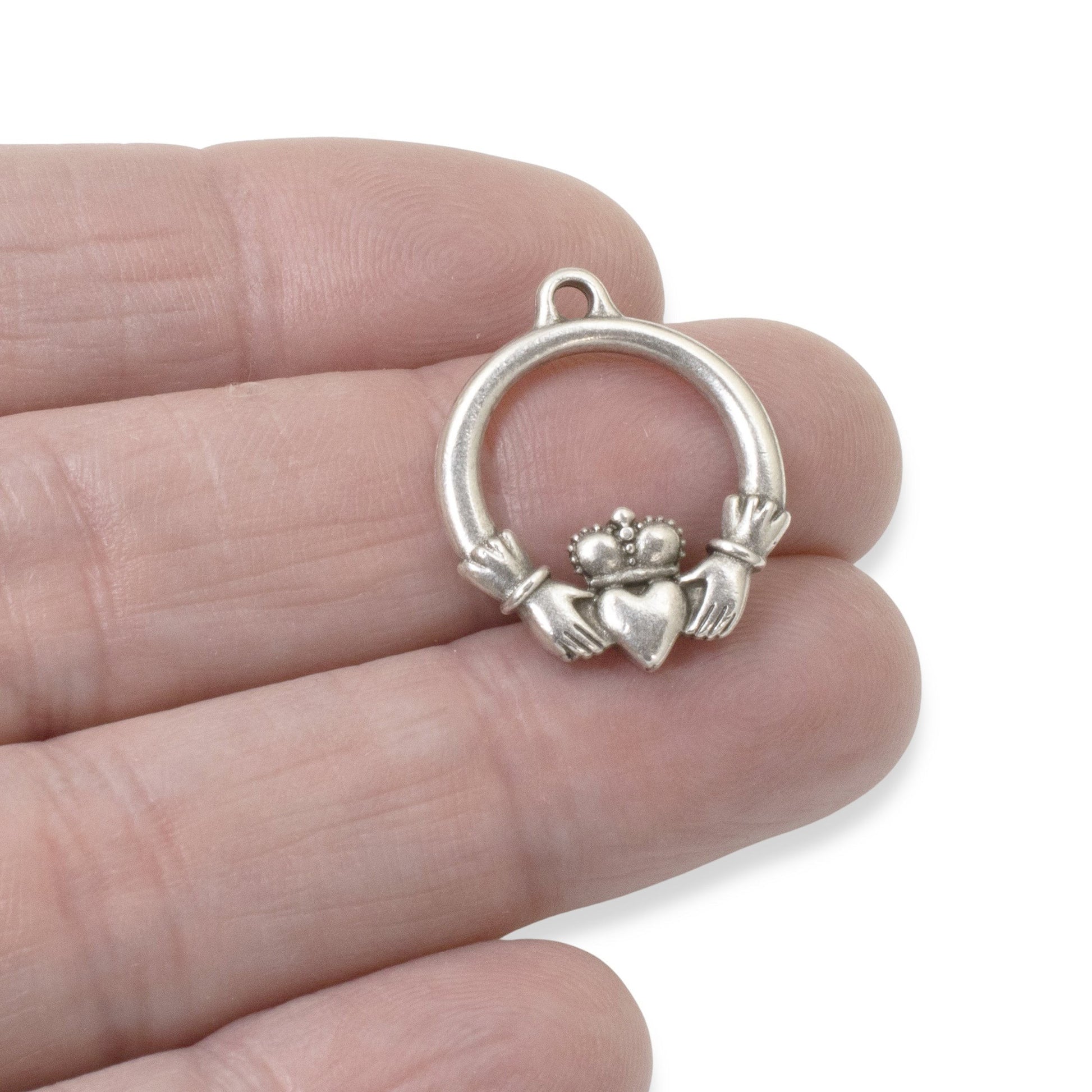 Hackberry Creek antique silver Claddagh charm pendant, symbolizing love, loyalty, and friendship. Crafted from pewter with .999 fine silver plating.