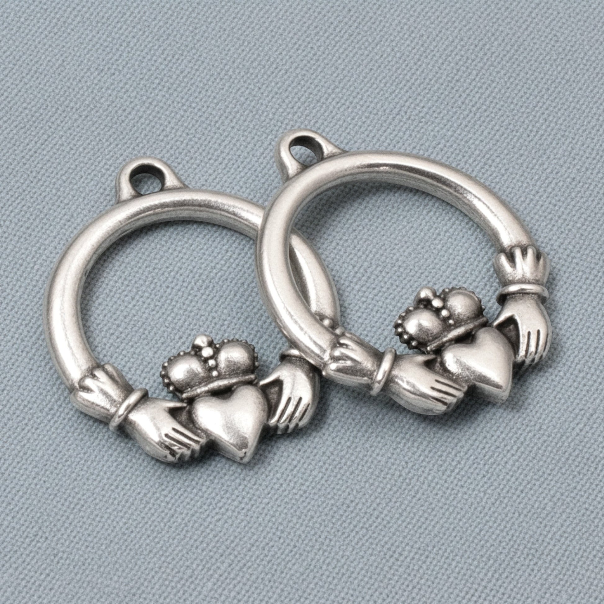 Hackberry Creek antique silver Claddagh charms, 2-pack pewter pendants with .999 fine silver plating, symbolizing love and friendship.