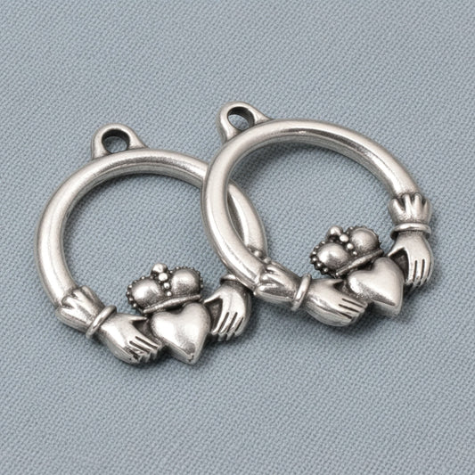 Hackberry Creek antique silver Claddagh charms, 2-pack pewter pendants with .999 fine silver plating, symbolizing love and friendship.