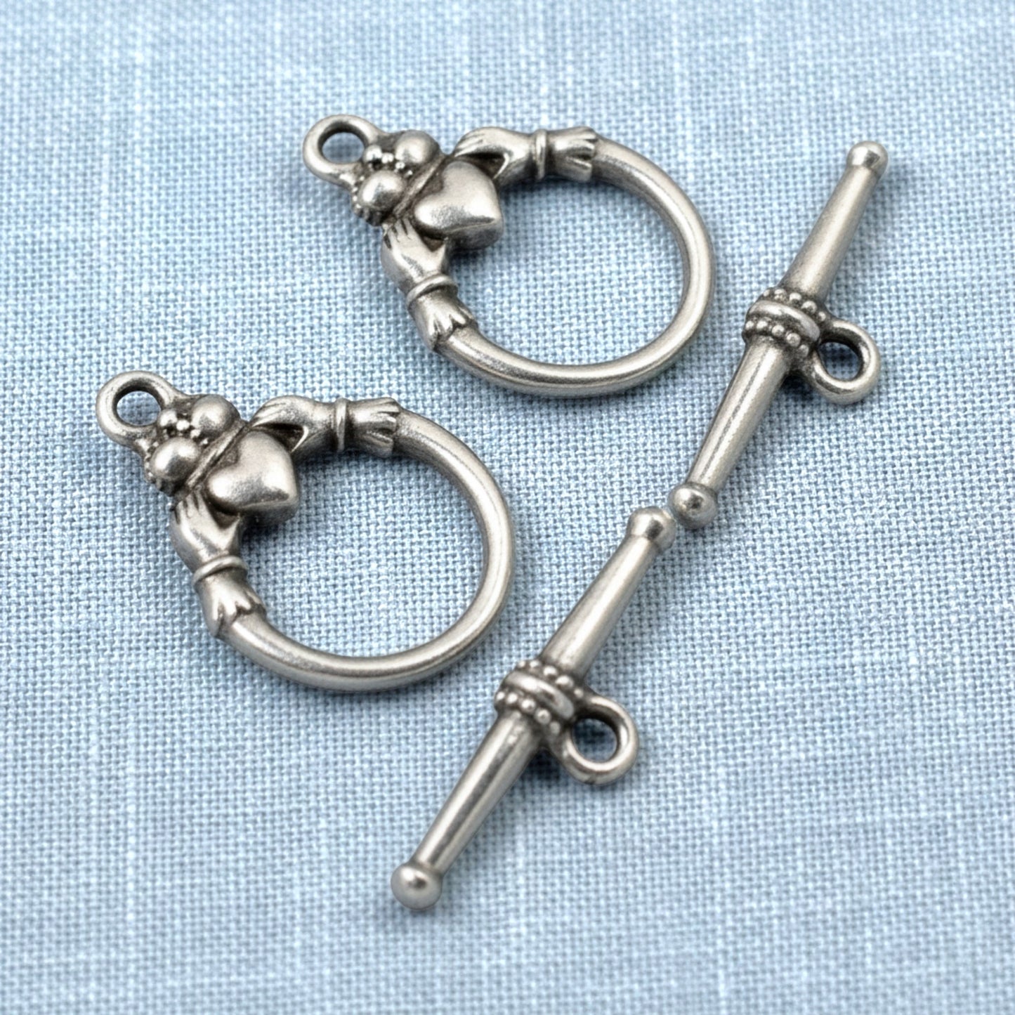 Hackberry Creek antique silver Claddagh toggle clasp sets for jewelry making. Features pewter with silver plating and intricate Claddagh design.