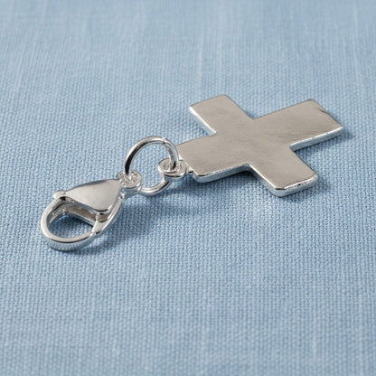 Hackberry Creek silver-plated cross charm with a stainless steel lobster clasp for bags or jewelry.