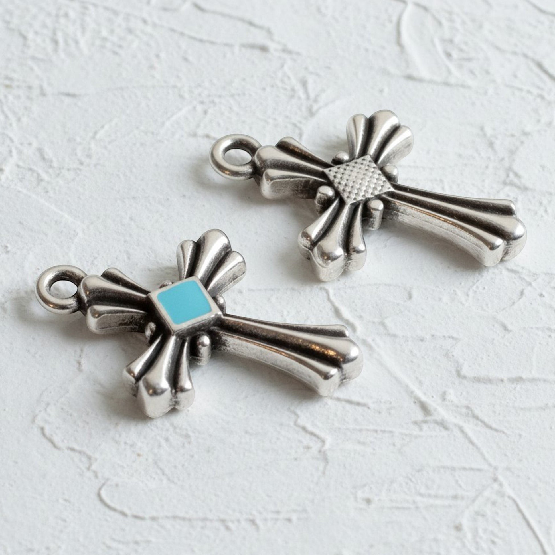 Hackberry Creek silver plated cross pendants with aqua enamel accents and art deco design. Set of 2.