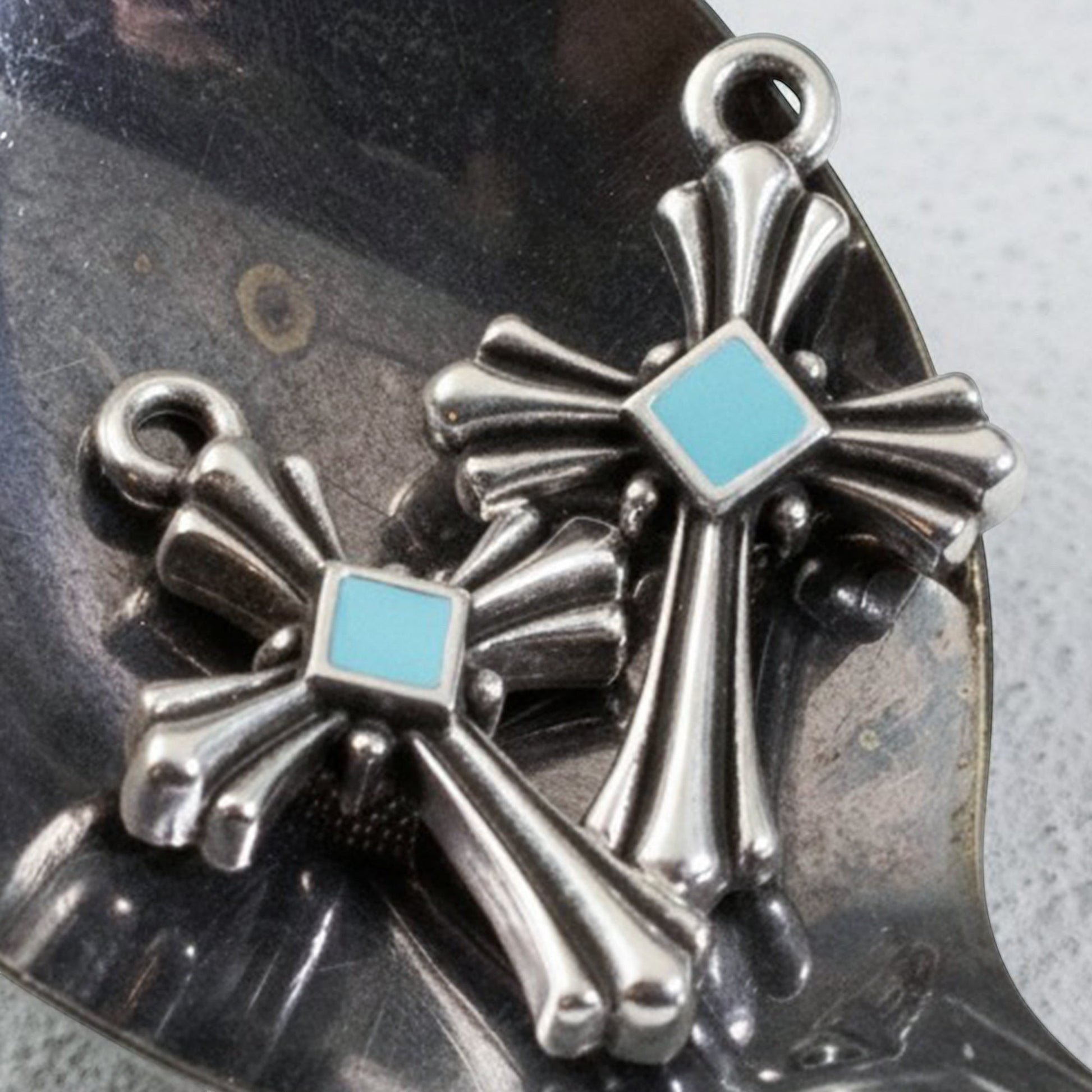 Hackberry Creek silver plated cross pendants with aqua enamel accents, art deco style, 2 pack.