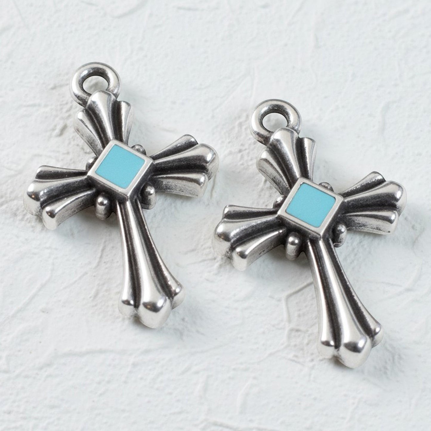 Hackberry Creek silver plated cross pendants with aqua enamel accents, art deco style, 2 pack.