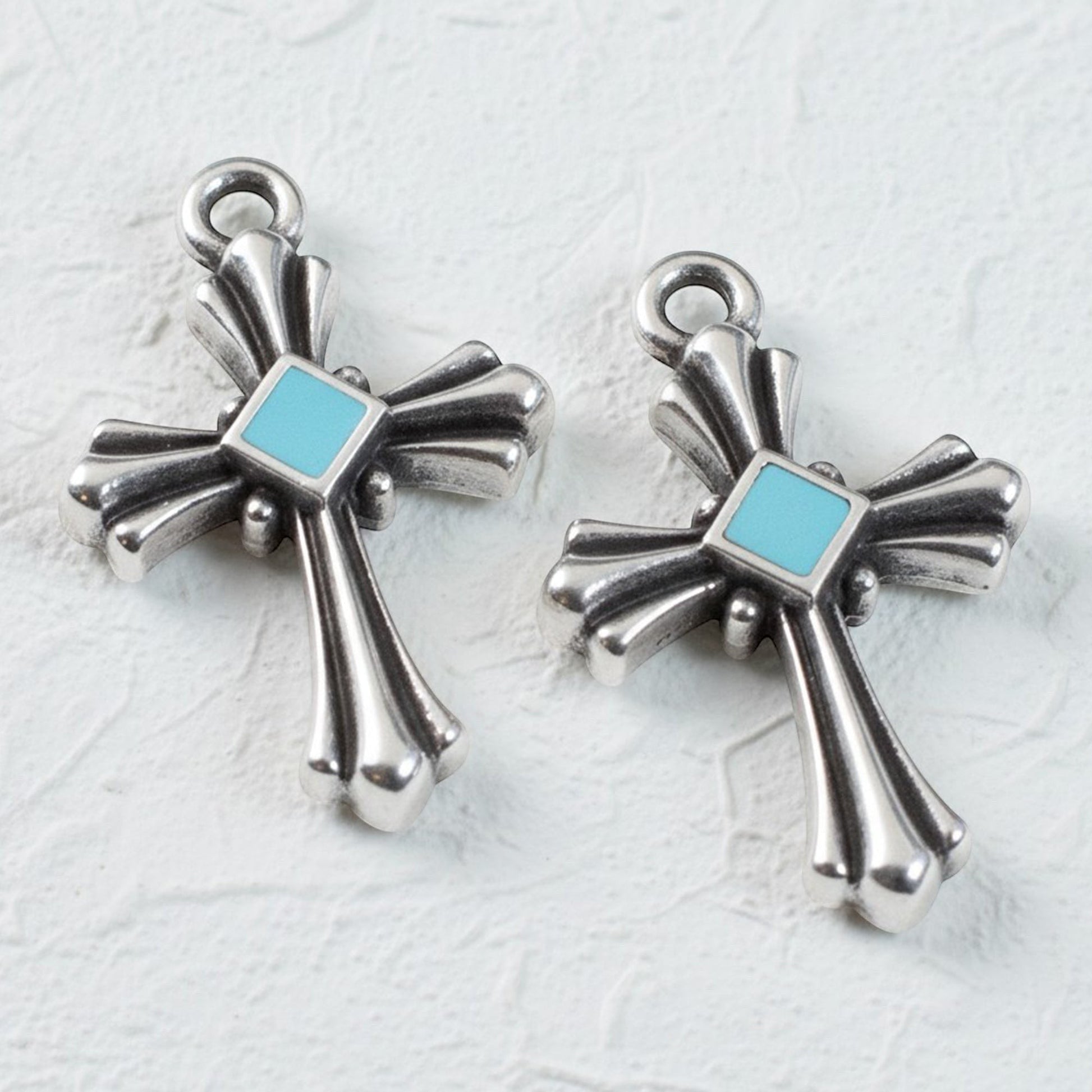 Hackberry Creek silver plated cross pendants with aqua enamel accents, art deco style, 2 pack.
