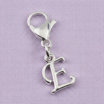 Hackberry Creek silver cursive letter E charm with a stainless steel lobster clasp for journals or bracelets.