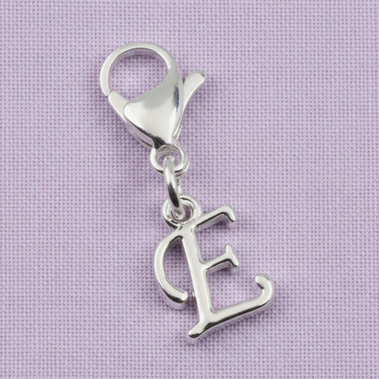 Hackberry Creek silver cursive letter E charm with a stainless steel lobster clasp for journals or bracelets.