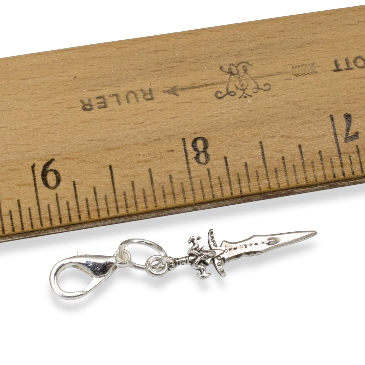 Hackberry Creek silver metal alloy double-sided dagger charm with lobster clasp, 1 3/4" long.