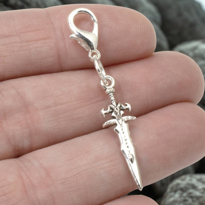 Hackberry Creek silver metal alloy double-sided dagger charm with lobster clasp. Medieval fantasy accessory.