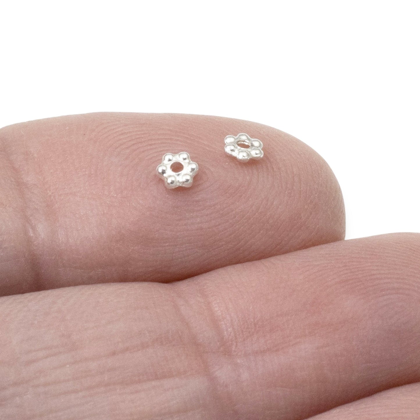 Hackberry Creek 50 bright silver 3mm daisy spacer beads made of lead-free pewter with fine silver plating.