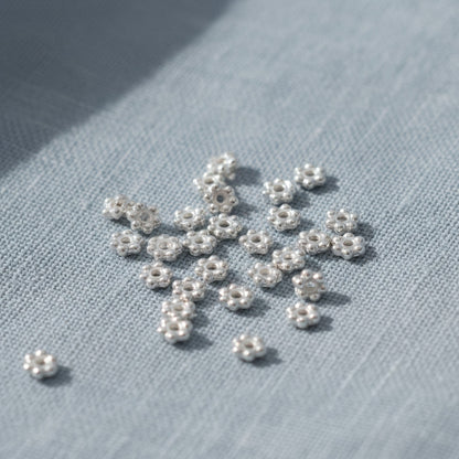 Hackberry Creek 500 bright silver 3mm daisy heishi spacer beads made of pewter with silver plating.