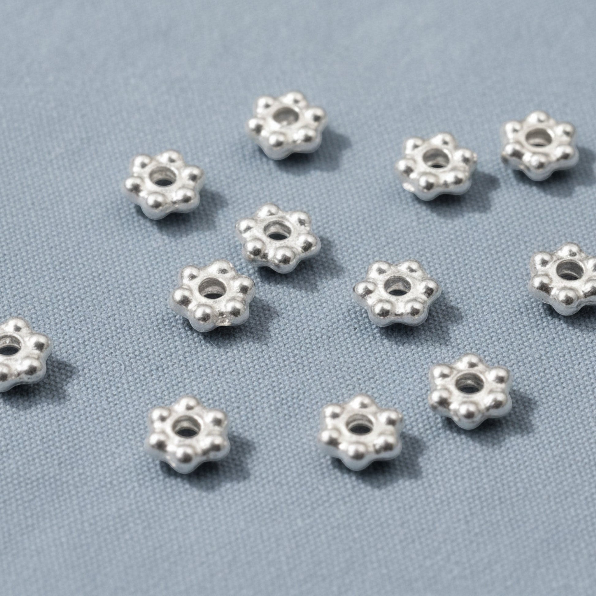Hackberry Creek 500 bright silver 3mm daisy heishi spacer beads made of pewter with silver plating.